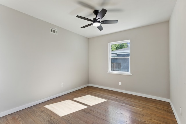 spare room featuring ceiling fan and hardwood / wood-style floors