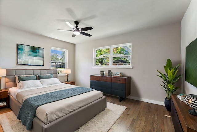 bedroom featuring hardwood / wood-style floors and ceiling fan