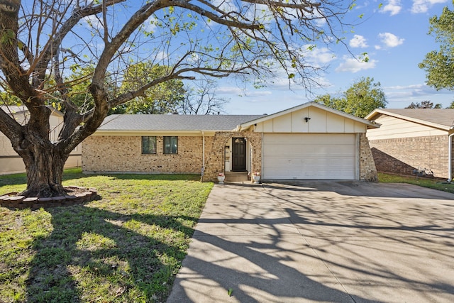 ranch-style house featuring a front yard and a garage