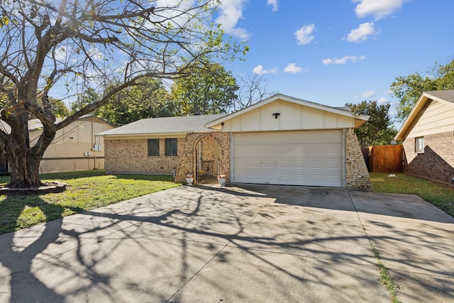 ranch-style house with a front yard and a garage