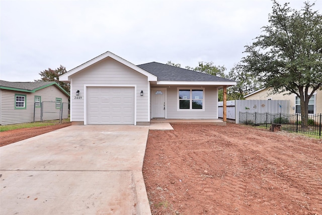 ranch-style home featuring a garage