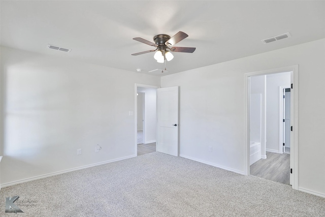 carpeted empty room with ceiling fan