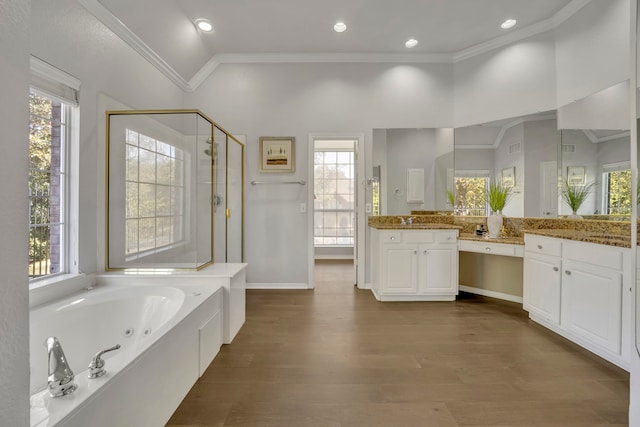 bathroom with hardwood / wood-style floors, vanity, lofted ceiling, ornamental molding, and shower with separate bathtub