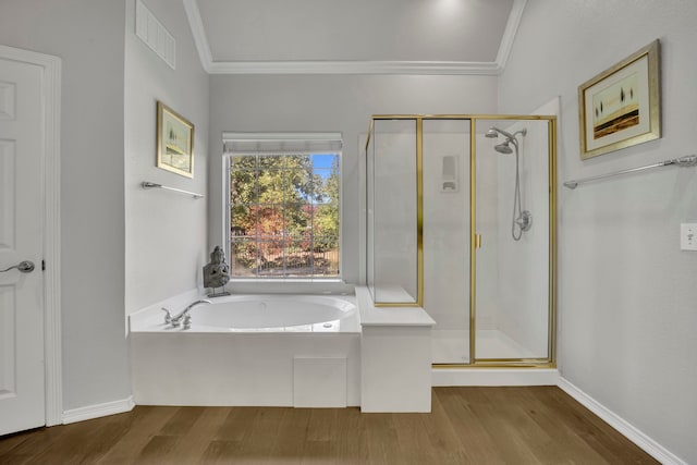 bathroom with shower with separate bathtub, ornamental molding, and wood-type flooring