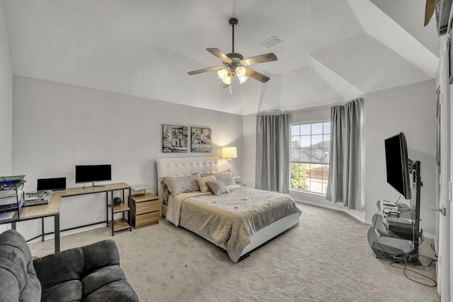 carpeted bedroom featuring ceiling fan and vaulted ceiling