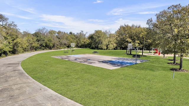 surrounding community featuring a lawn, a playground, and basketball court