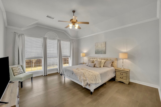 bedroom featuring hardwood / wood-style flooring, vaulted ceiling, ceiling fan, and ornamental molding