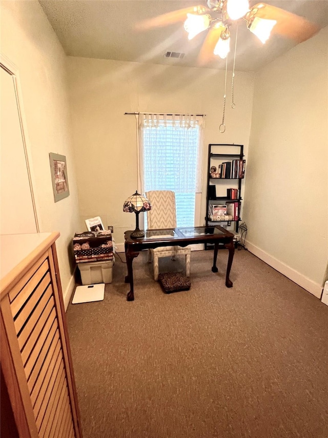 home office featuring carpet, visible vents, ceiling fan, and baseboards