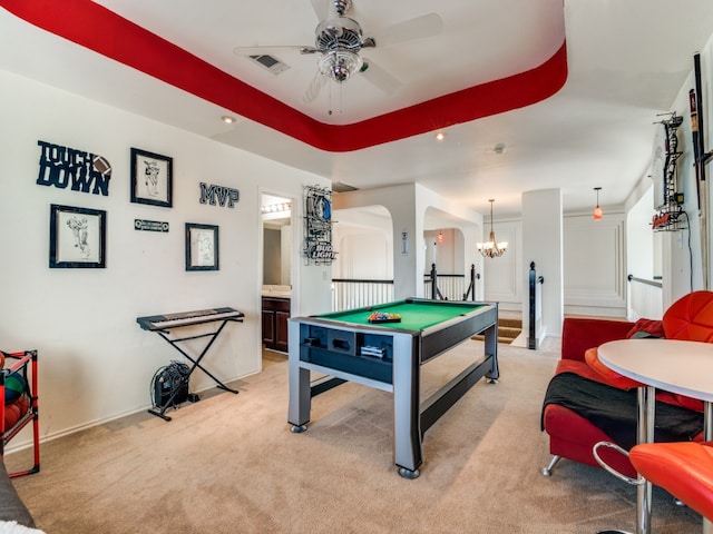 recreation room featuring ceiling fan with notable chandelier, light carpet, and pool table