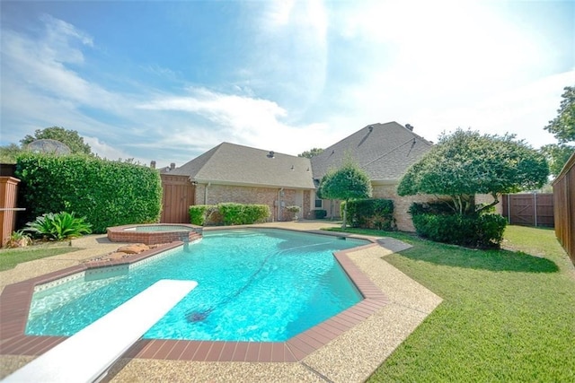 view of pool with an in ground hot tub, a diving board, and a lawn