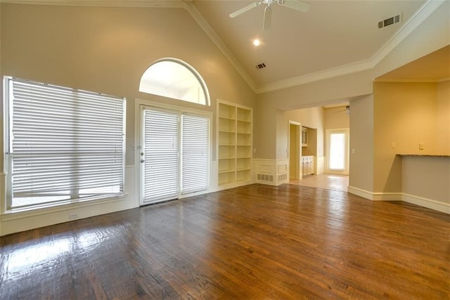 spare room with hardwood / wood-style flooring, ceiling fan, crown molding, and built in shelves