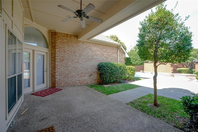 view of patio featuring ceiling fan