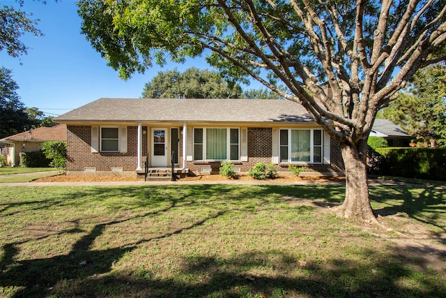 ranch-style home with a front yard