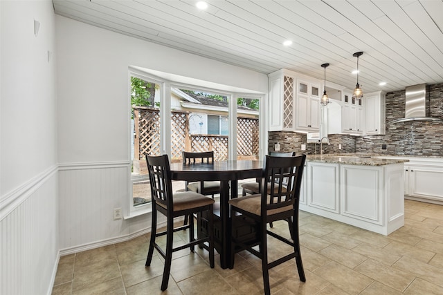 dining space with wooden ceiling