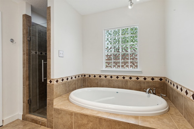 bathroom featuring independent shower and bath