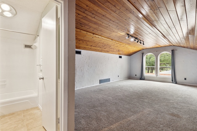 bonus room with wood ceiling, light carpet, and vaulted ceiling