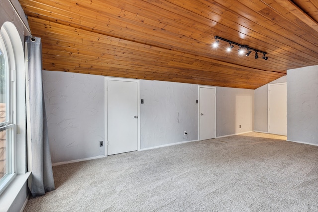 additional living space with wooden ceiling, light colored carpet, and lofted ceiling