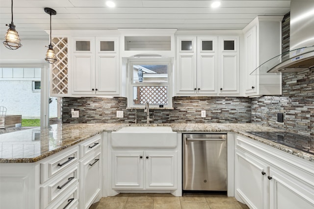 kitchen featuring stainless steel dishwasher, wall chimney exhaust hood, white cabinetry, and sink