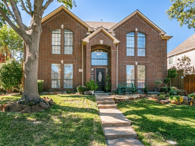 view of property featuring a front yard