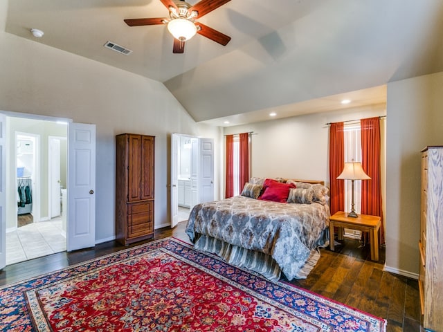 bedroom with dark hardwood / wood-style flooring, vaulted ceiling, ceiling fan, and ensuite bathroom