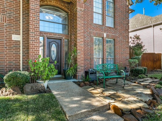 entrance to property featuring a patio area