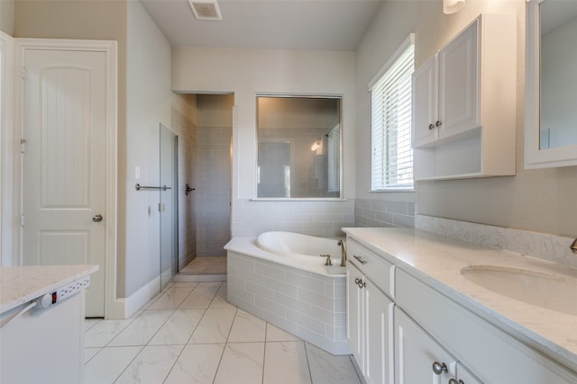 bathroom with plus walk in shower and vanity