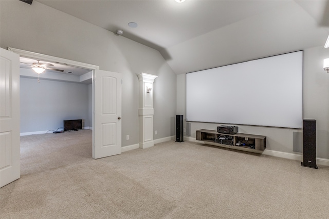 cinema room featuring carpet, vaulted ceiling, and ceiling fan