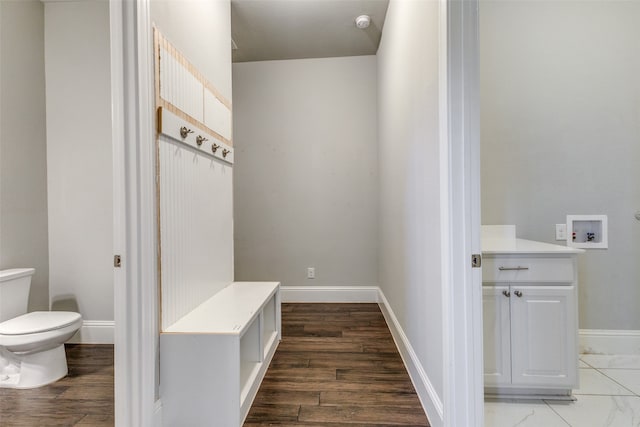 mudroom with dark hardwood / wood-style flooring