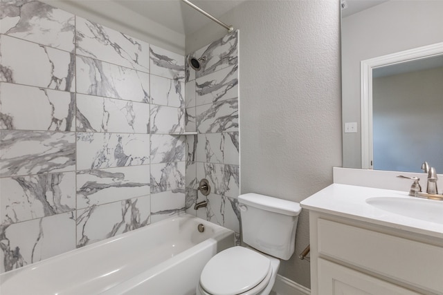 full bathroom featuring tiled shower / bath combo, toilet, and vanity