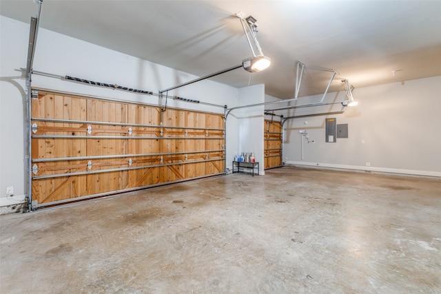 garage featuring electric panel and a garage door opener