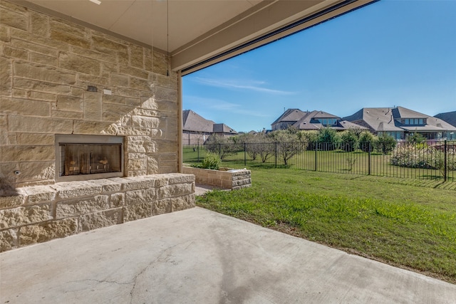 view of patio featuring an outdoor stone fireplace