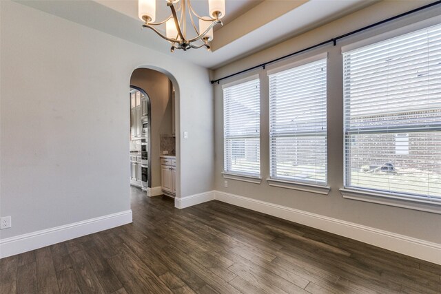 empty room featuring dark hardwood / wood-style flooring