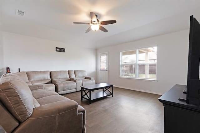 living room featuring ceiling fan and wood-type flooring