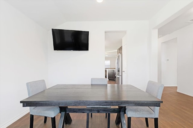 dining room with hardwood / wood-style floors