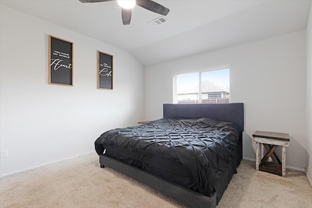 carpeted bedroom featuring vaulted ceiling and ceiling fan