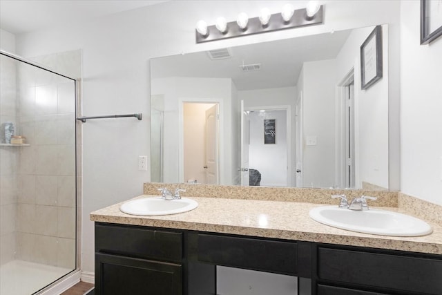 bathroom featuring vanity and walk in shower