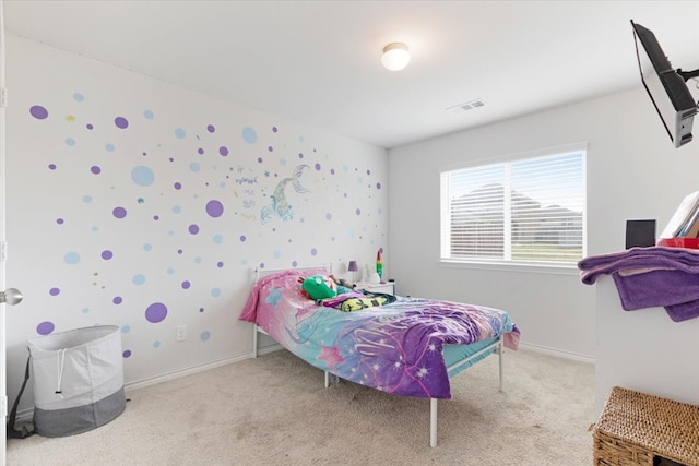 bedroom featuring light colored carpet