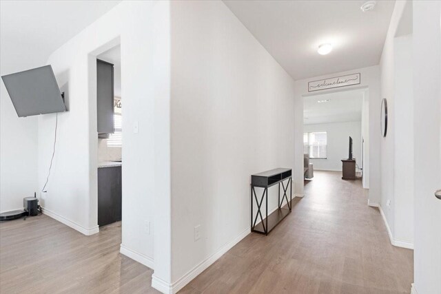 corridor featuring light hardwood / wood-style floors