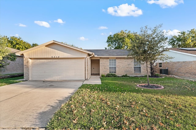 single story home featuring cooling unit, a front lawn, and a garage