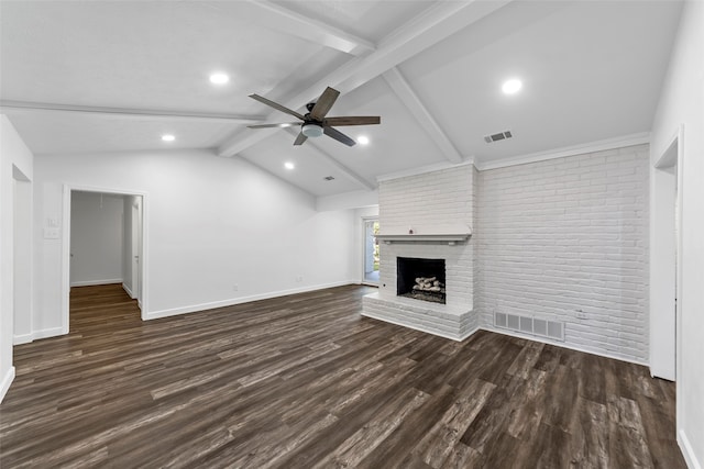 unfurnished living room with ceiling fan, a brick fireplace, brick wall, lofted ceiling with beams, and dark hardwood / wood-style floors