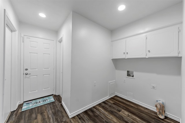 clothes washing area featuring cabinets, hookup for a washing machine, electric dryer hookup, and dark wood-type flooring