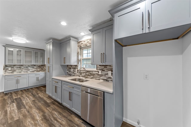 kitchen with gray cabinets, sink, and stainless steel dishwasher