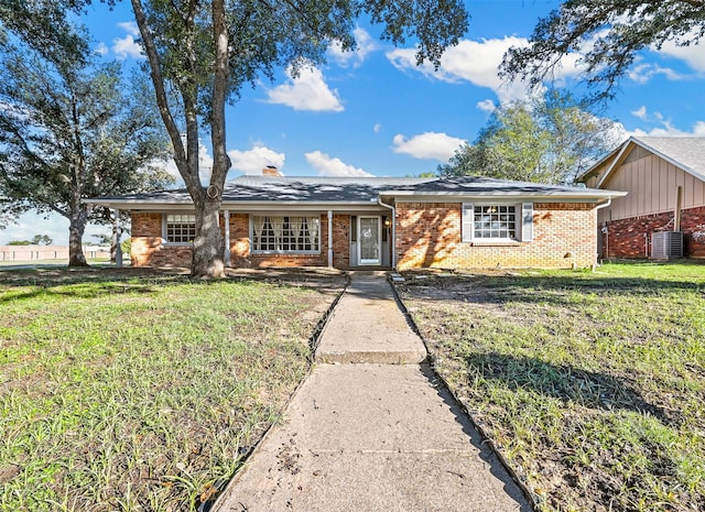 7101 Ellis Rd, Fort Worth, TX 76112 - view of front of property with brick siding, a front yard, and a chimney