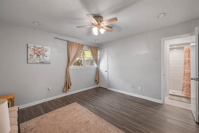 7101 Ellis Rd, Fort Worth, TX 76112 - unfurnished bedroom featuring dark wood-style flooring, baseboards, ceiling fan, and ensuite bathroom