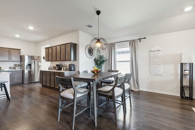 dining room with dark hardwood / wood-style floors