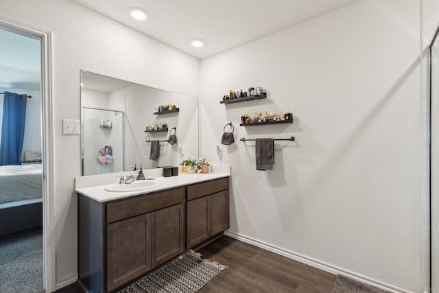 bathroom with vanity and wood-type flooring