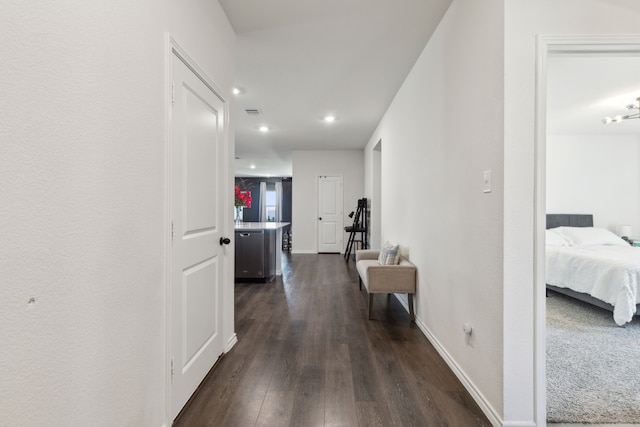 hall with dark hardwood / wood-style flooring