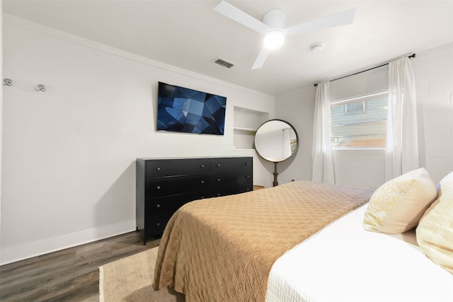 bedroom featuring ceiling fan and dark hardwood / wood-style flooring