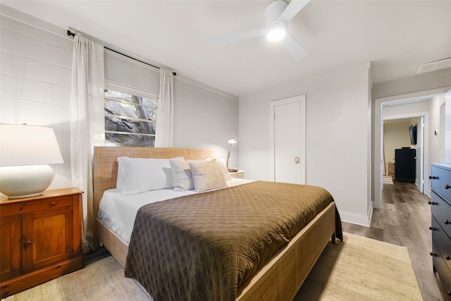 bedroom featuring ceiling fan and light wood-type flooring