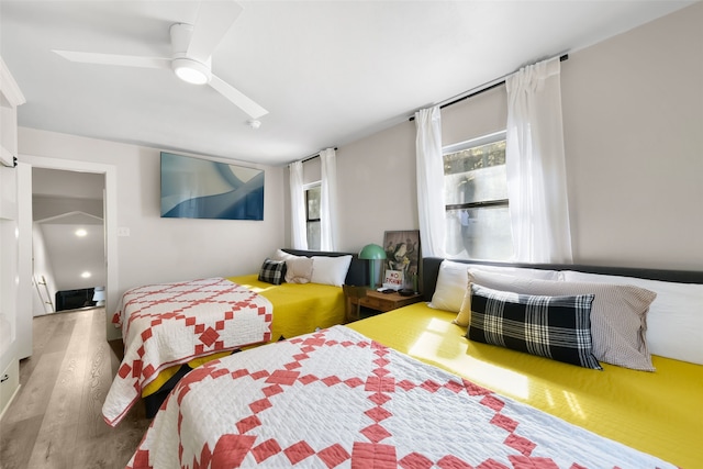 bedroom featuring hardwood / wood-style floors and ceiling fan